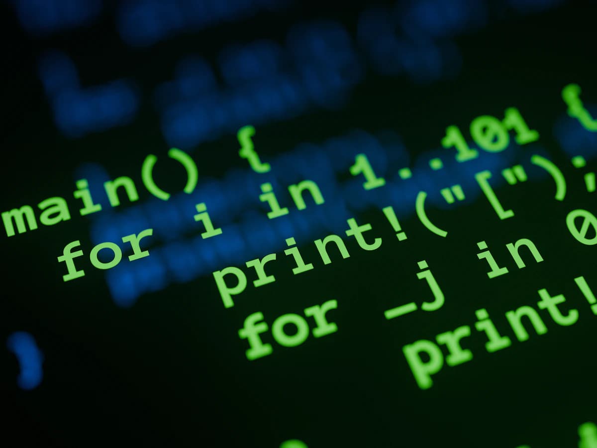 Source code glowing green on a dark screen